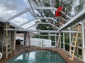 Pool cage during and after power washing