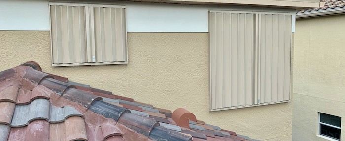 Accordion hurricane shutters installed at home on Ardore Ln, Estero 33928