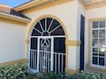 Screen door at home on Coco Hammock Way. Iona 33908