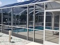 Screen door of a pool enclosure on Ft Myers Beach