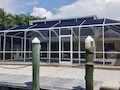 View of pool cage from boat dock on Ft Myers Beach