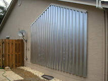 Panel hurricane shutters