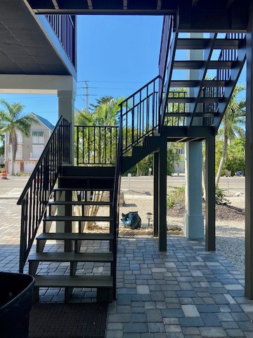 Wooden staircase with new hand railings on Ft Myers Beach
