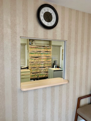 Cape Coral dentist office window with sneeze guard installed