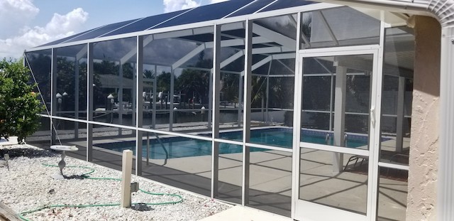 Screen door of a pool enclosure on Ft Myers Beach